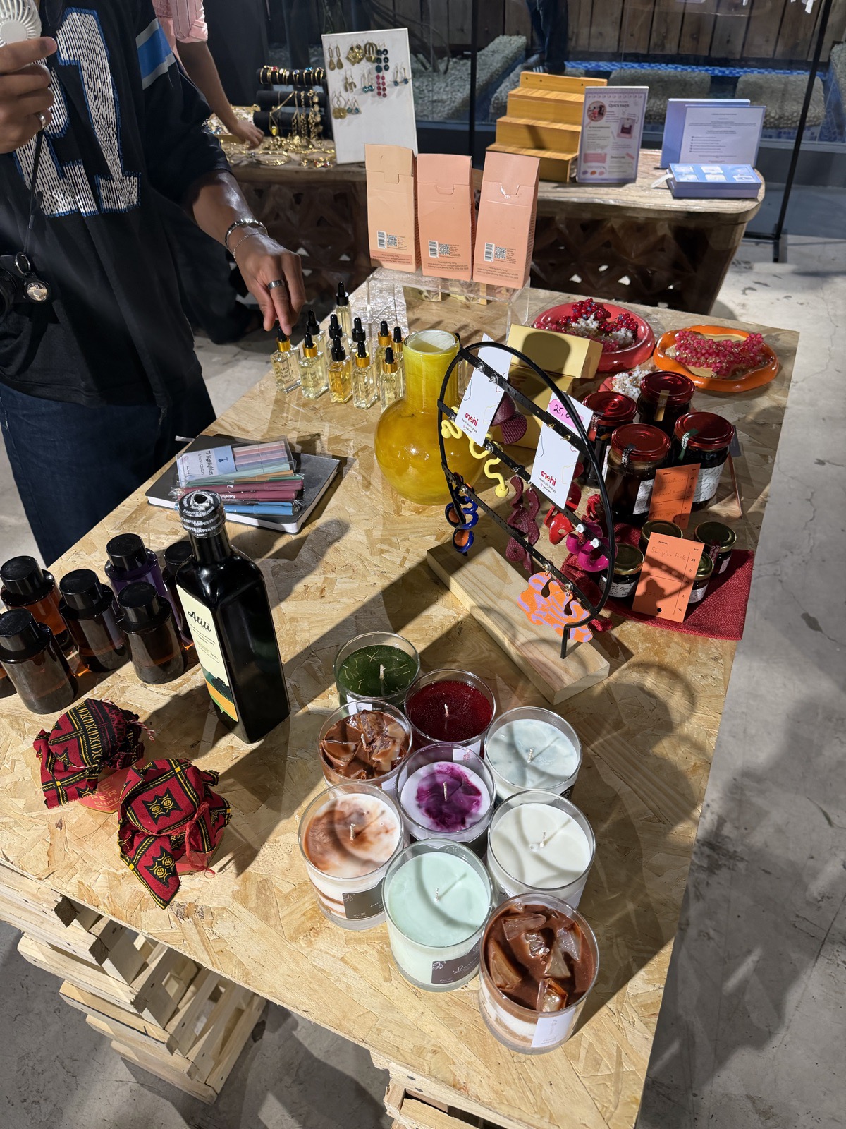 Candles and preserves on a vendor table