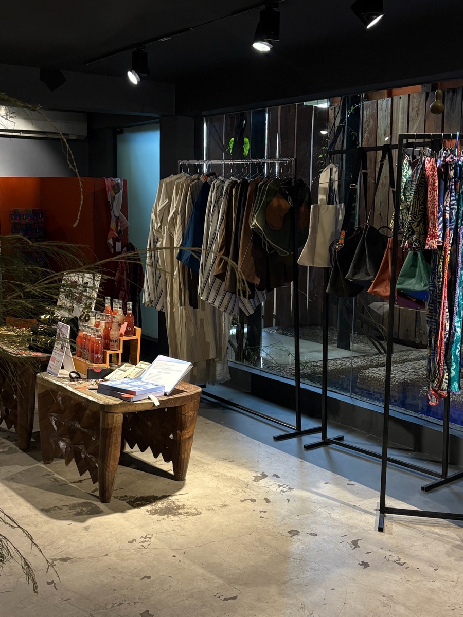 Clothing rails and a styled table inside the pop-up